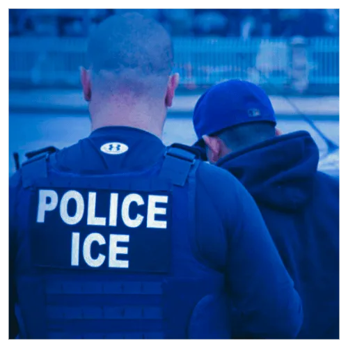 Immigration/Border: an enforcement officer detaining an individual