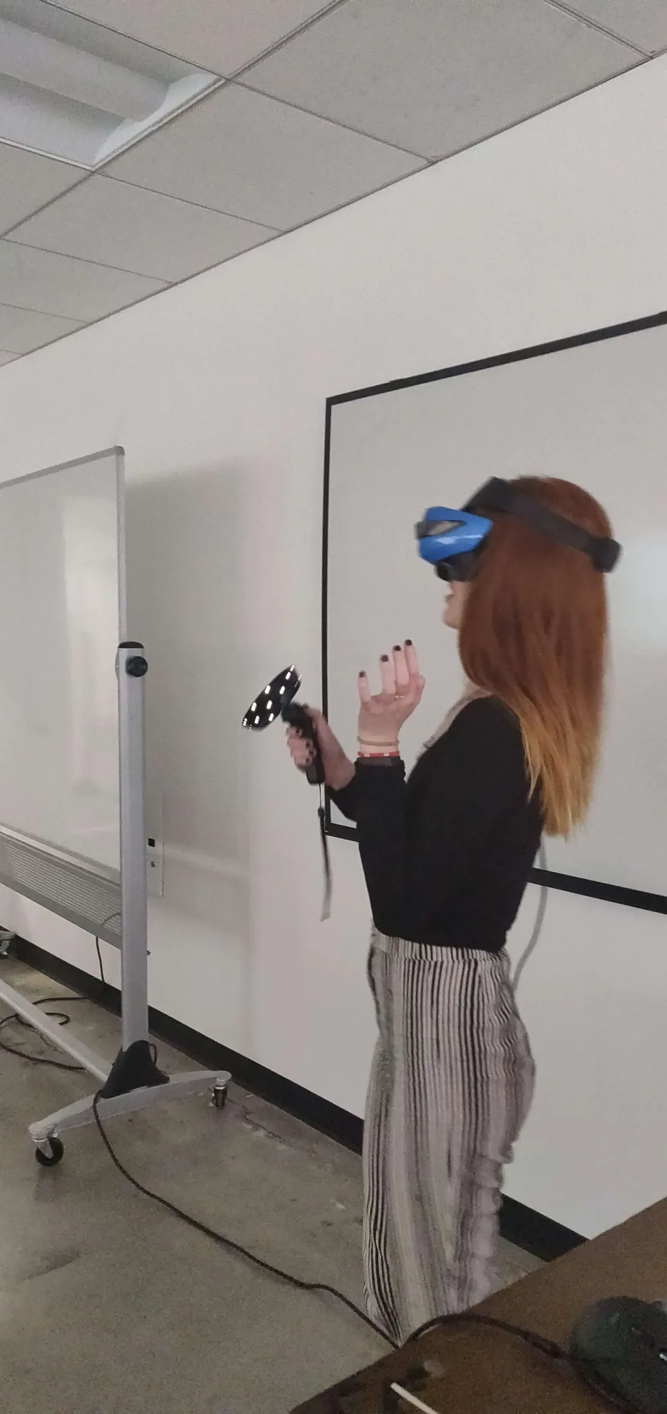Surprised woman wearing VR headset experiencing VR for the first time